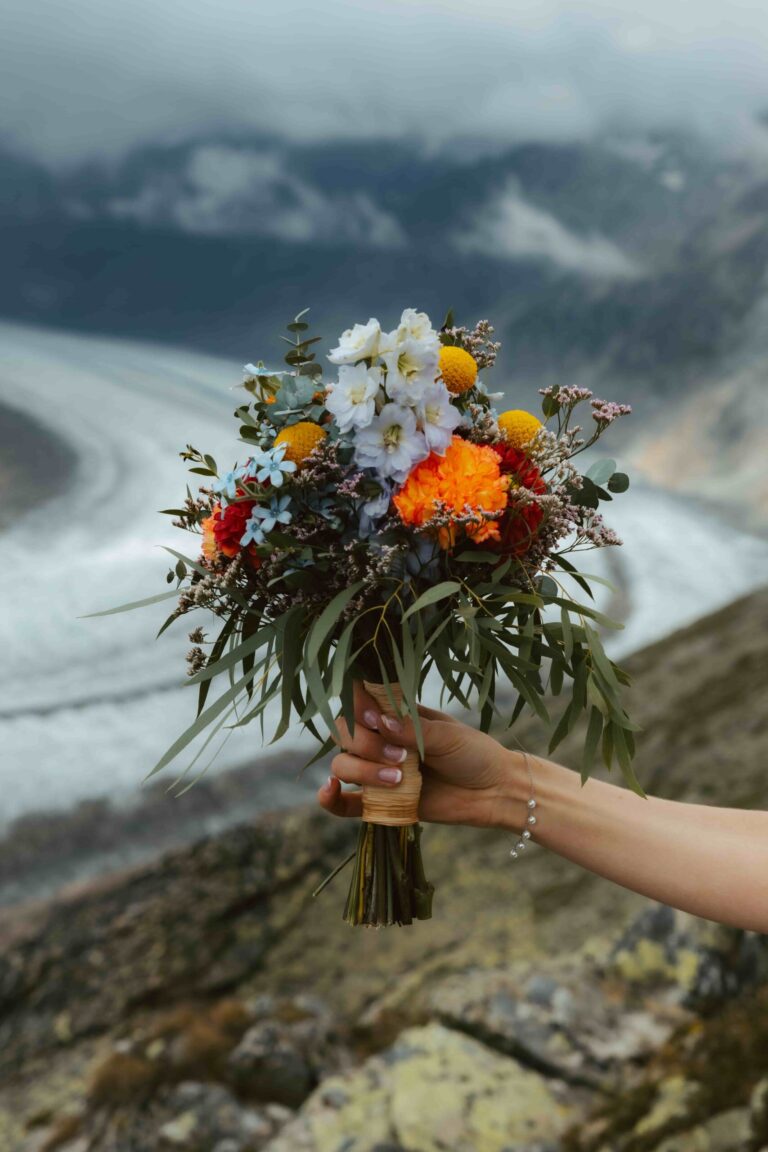 Flower bouquet in front of mountains and a glacier